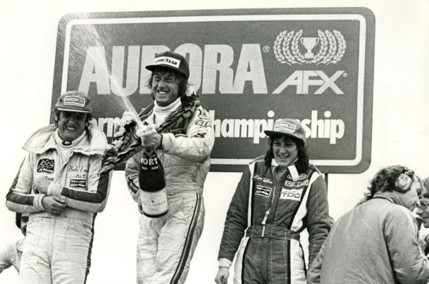 Bob Evans, Guy Edwards, Desire Wilson celebrating podium at Thruxton, Aurora AFX British F1 series, 1978